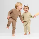 UV-joggingbroekje-kinderen-in-Peanut-Brown-and-Sandy-Beach-Cloby.webp